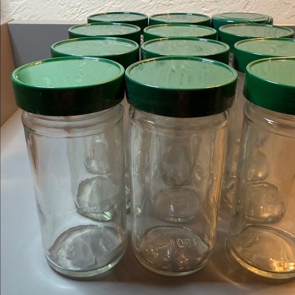 Set of 12 Vintage Glass Round Spice Jars W/ Green Lids, Approximately 4.5” Tall - Picture 2 of 8